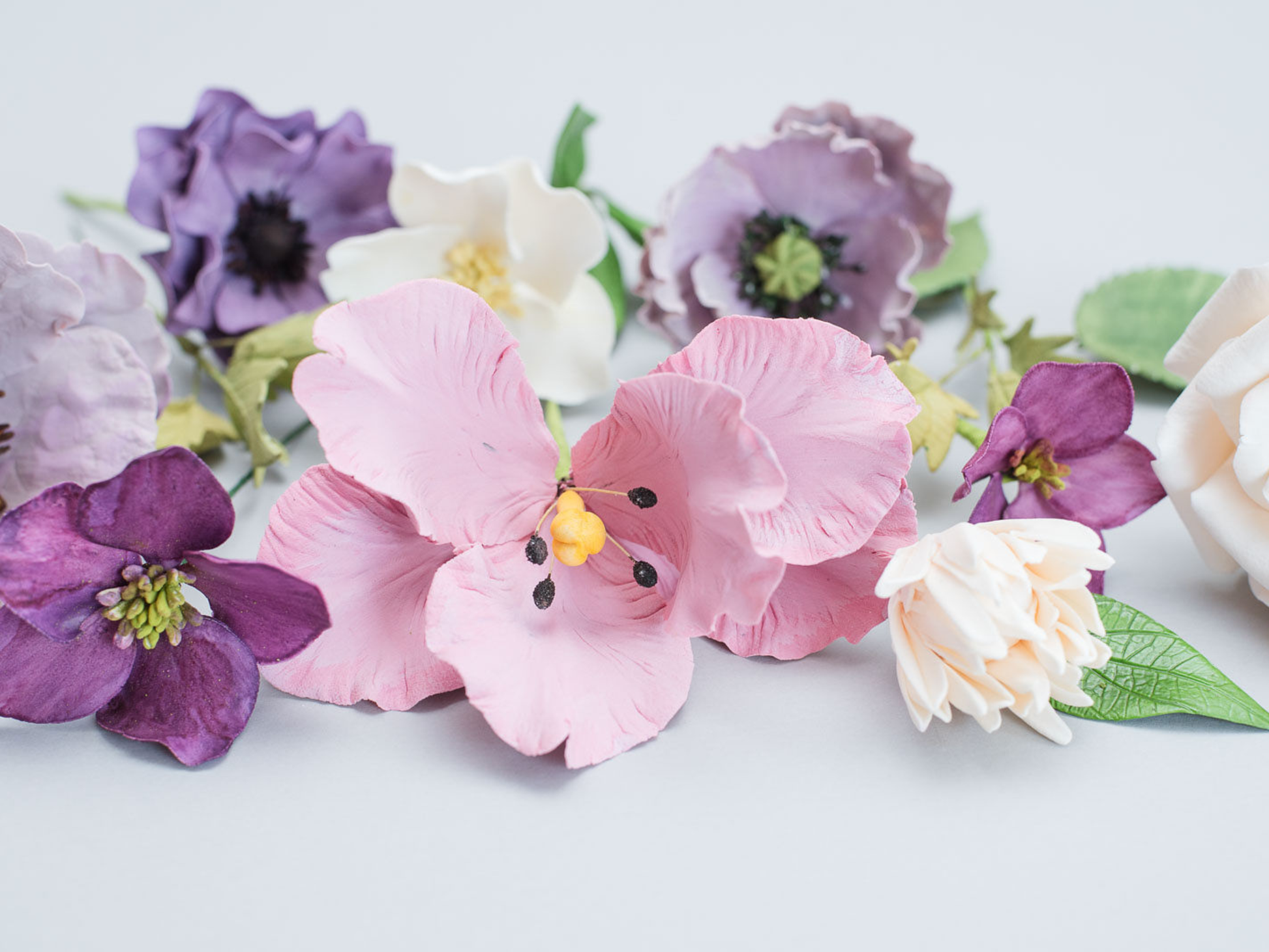 Colorful sugar flowers on a white background