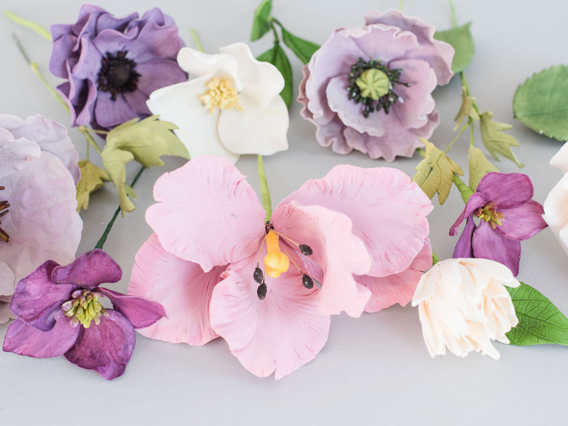 Colorful sugar flowers on a light background