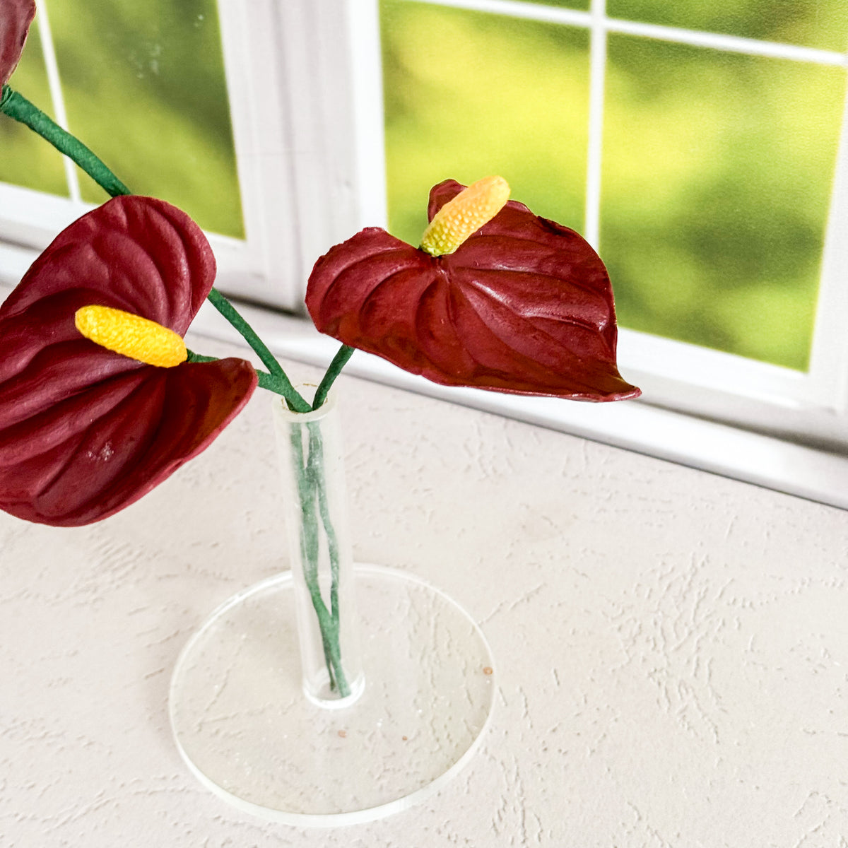 arrangement of two burgundy anthurium lily sugar flowers