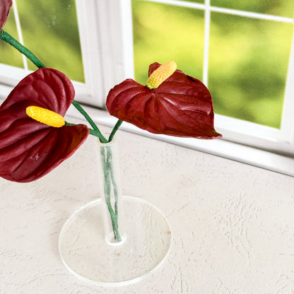 arrangement of two burgundy anthurium lily sugar flowers